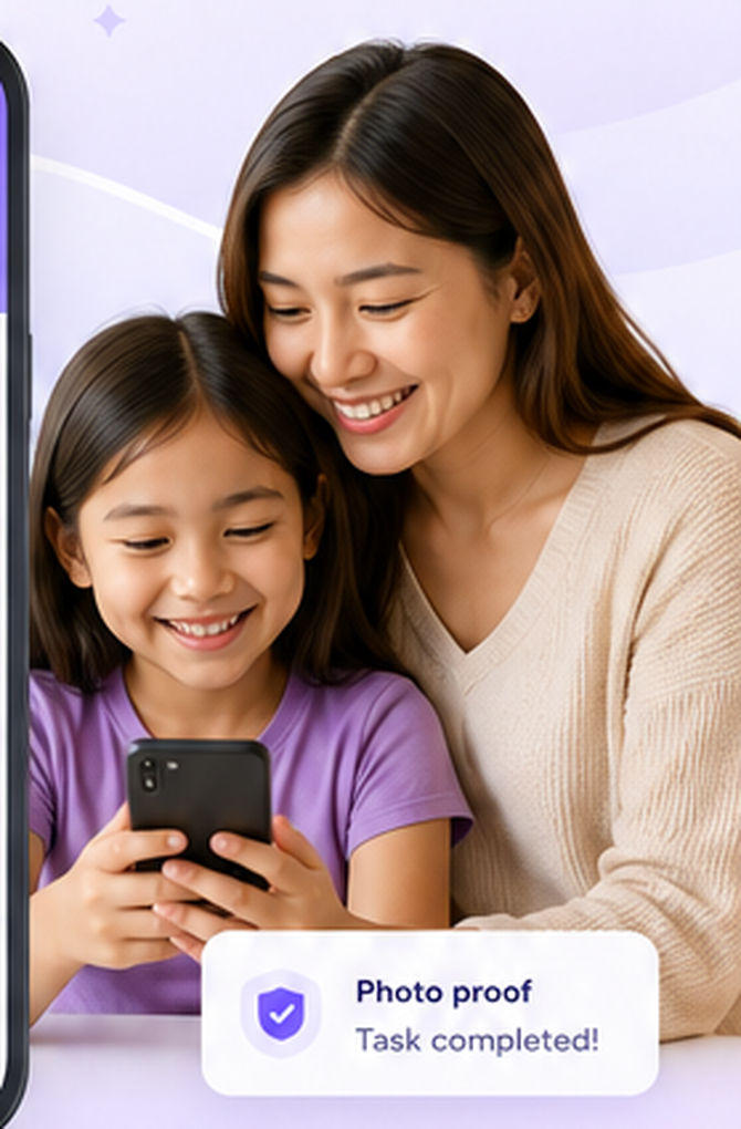 Parent and child looking at a phone together after completing a task